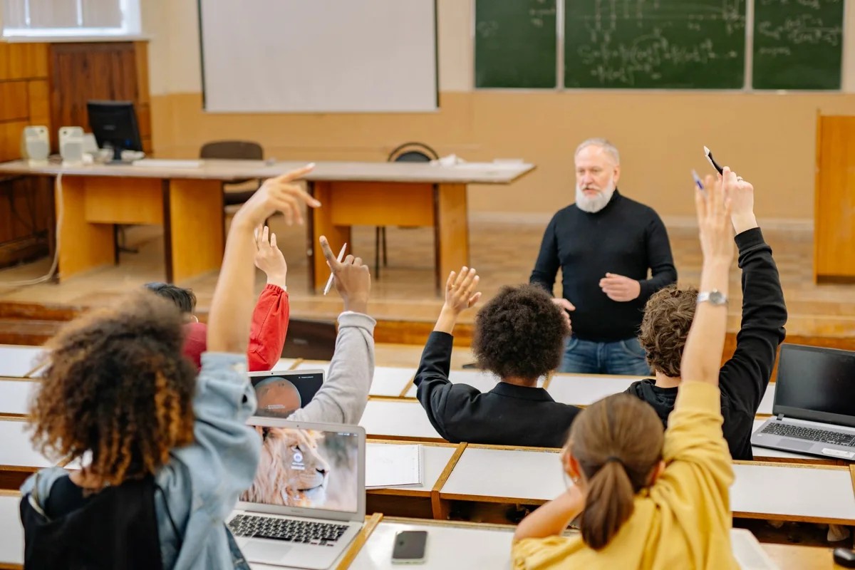 Students participating in a lecture in a university classroom.